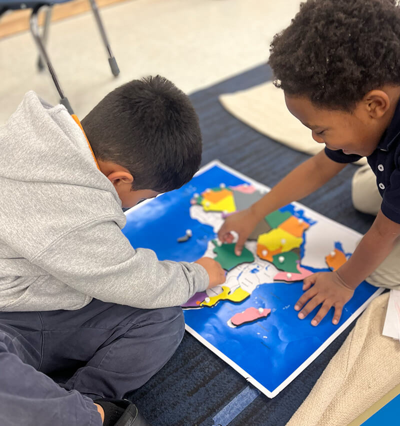 kids solving puzzle